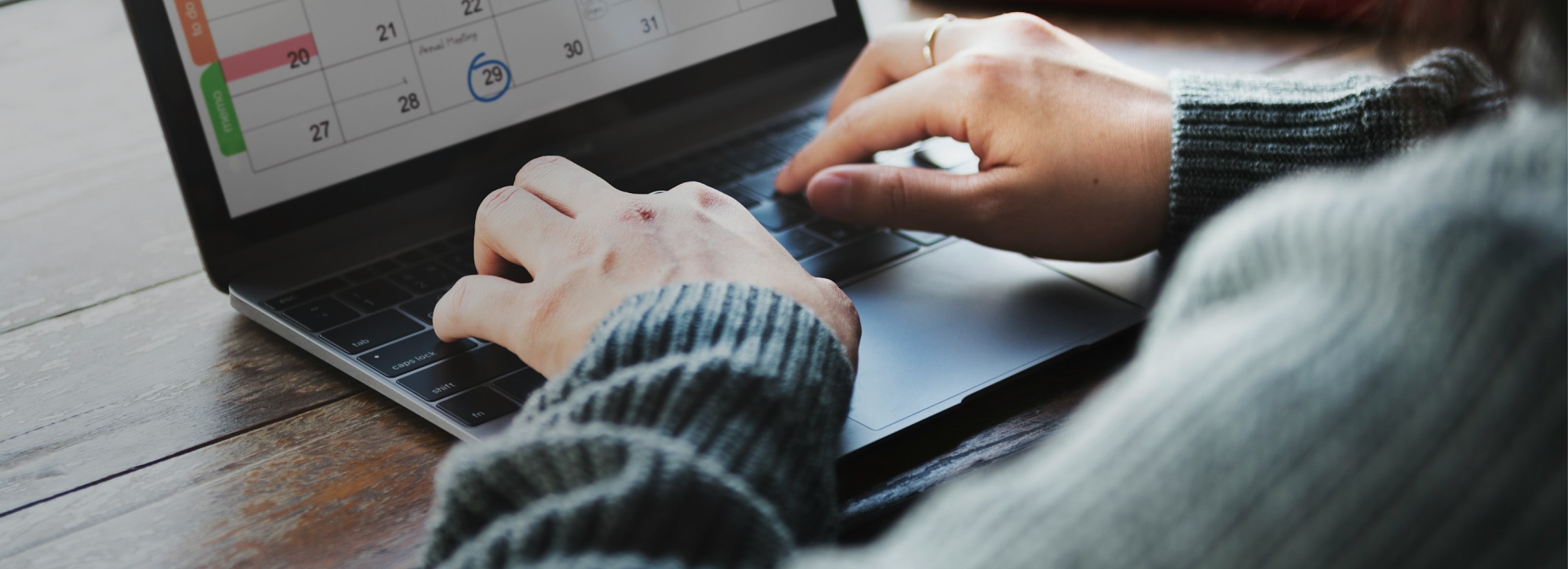 Employer reviewing work on a laptop